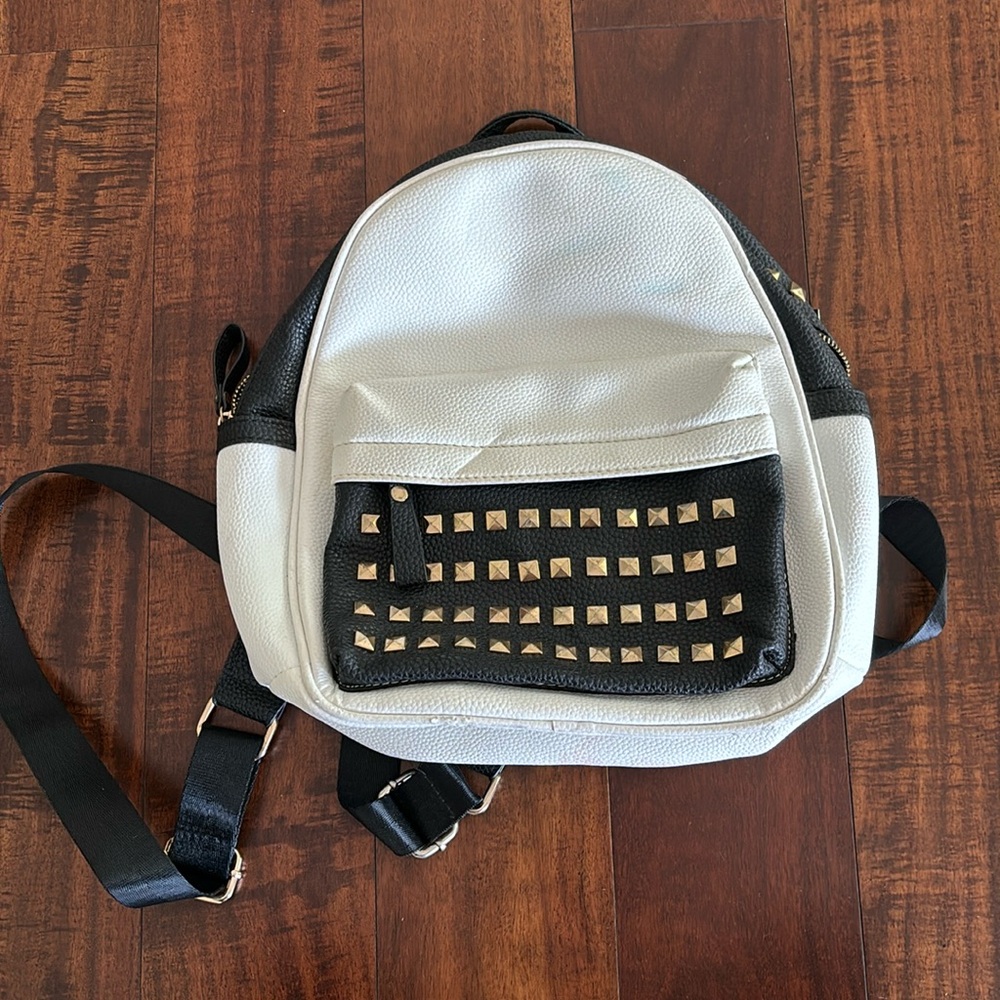 Y& R backpack with gold studs in the front pocket